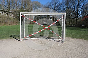 Soccer goal blocked due to corona crisis on a playground in a public green area in Hamburg, Germany