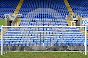 Soccer goal and blue seats