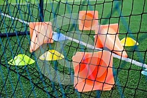 Soccer goal and cones on green artificial turf