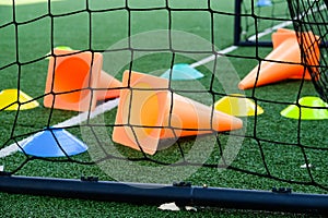 Soccer goal and cones on green artificial turf