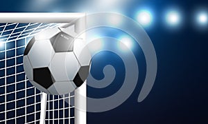 Soccer goal and football with spotlight background in stadium