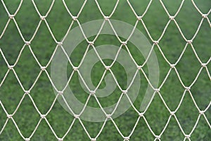 Soccer goal net on football field.