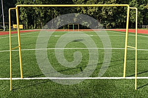 Soccer goal on the New football stadium near a new residential building. Ukraine