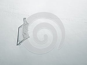 Soccer goal and pitch under snow in winter