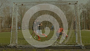 Soccer goalie making a save during football game