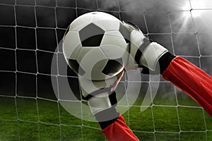 Soccer goalkeeper catches the ball photo