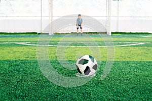 Soccer goalkeeper on the field. Young boy as a football goalkeeper.