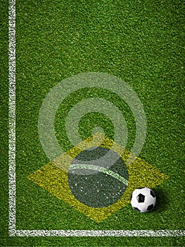 Soccer grass field corner with ball and flag of Brazil