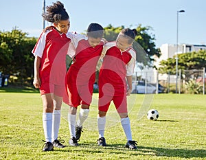 Soccer, injury and children team help, support and walk with hurt friend during game at a sports field. Sport, accident