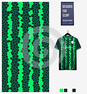 Soccer jersey pattern design. Mosaic pattern on green background for soccer kit, football kit. Abstract background.