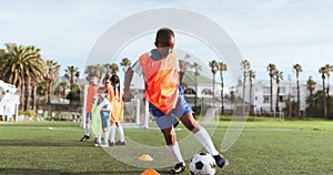 Soccer, kid kick and training field for game and sport drill for workout and exercise on a school cardio. Students