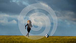 Soccer kid. Kids play football on summer stadium field. Little child boy kicking ball. Football sport training for