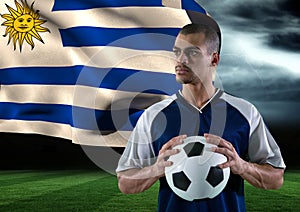 soccer player with ball on his hand in the field. storm. flag behind