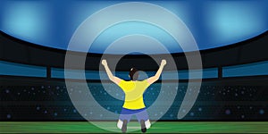 Soccer player celebrating goal on a soccer stadium.