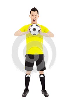 Soccer player exclaimed and holding a soccer