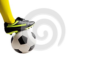 Soccer player feet kicking soccer ball