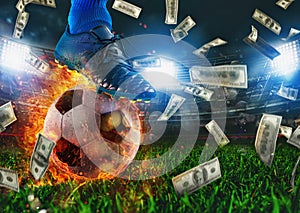 Soccer player with a fiery ball and falling banknotes in stadium