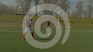 Soccer player going for penalty kick during match