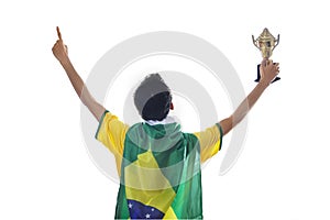 Soccer player holding trophy isolated