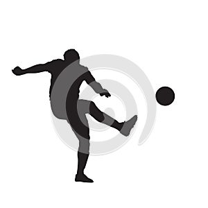 Soccer player kicking ball, isolated vector silhouete. Footballer playing soccer photo