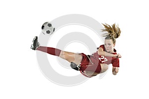 Soccer Player Kicking Ball in Mid Jump photo