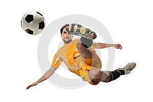 Soccer Player Kicking Ball in Midair photo