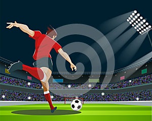 Soccer Player Kicking Ball in stadium. Light, stands, fans.