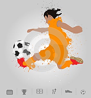 Soccer player kicks the ball with paint splatter design photo