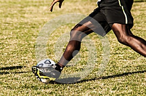 Soccer player legs in action