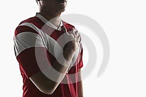 A soccer player listening to team anthem