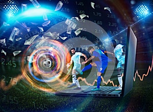 Soccer player play on a laptop concept of football online betting