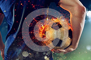 Soccer player ready to play with fiery soccerball