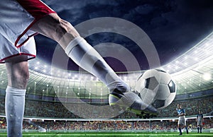 Soccer player with soccerball at the stadium ready for the match