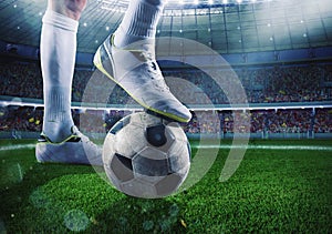 Soccer player with soccerball at the stadium ready for the match photo