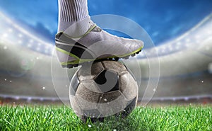 Soccer player with soccerball at the stadium ready for World cup