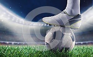 Soccer player with soccerball at the stadium ready for World cup