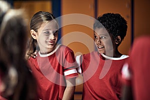 Soccer player before training.Girl and boy friends    before training  in changing room