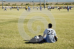 Soccer player watching the action.