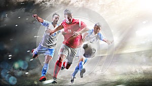 Soccer players in action on the grand stadium background panorama