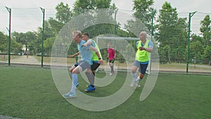 Soccer players jostling for position on football pitch at daybreak