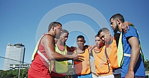 Soccer players planning strategy on the field