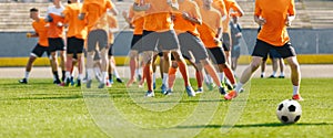 Soccer Players on Daily Practice Unit. Football Club Training Session. Athletes Running on Soccer Grass Field. Soccer Team