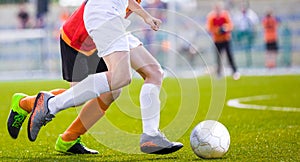 Soccer Players Running After the Ball on the Pitch. Football Match