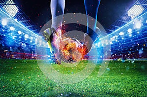 Soccer players with soccerball on fire at the stadium during the match