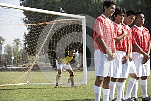 Soccer Players Standing In A Row Preparing For Free Kick