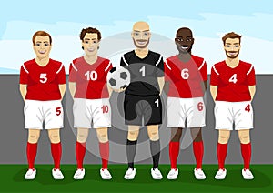 Soccer players team group with goalkeeper holding soccer ball