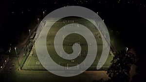 Soccer Practice on a Floodlit Astroturf Pitch