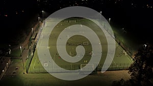 Soccer Practice on a Floodlit Astroturf Pitch