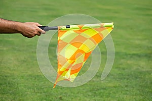 Soccer referee hold the flag. Offside trap