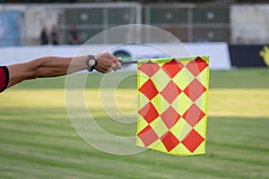 Soccer referee hold the flag. Offside trap